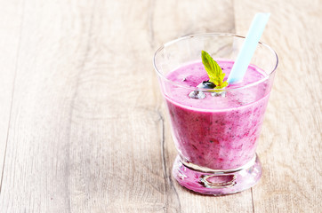 Blueberry shake on white table