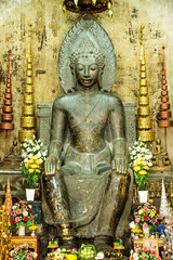 Asian religious art. Ancient green stone sculpture of Buddha at
