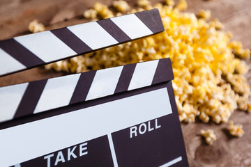 Movie clapper board and pop corn