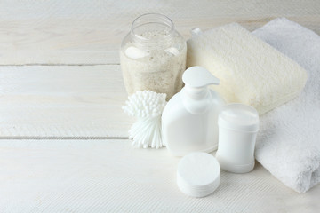 Fototapeta na wymiar personal hygiene products on white wooden background