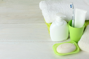 Fototapeta na wymiar personal hygiene products on white wooden background