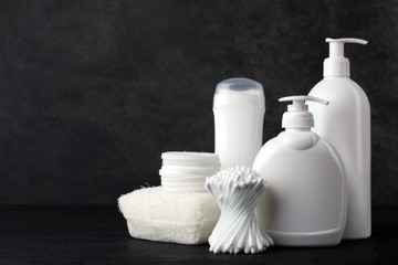 personal hygiene items on a black background