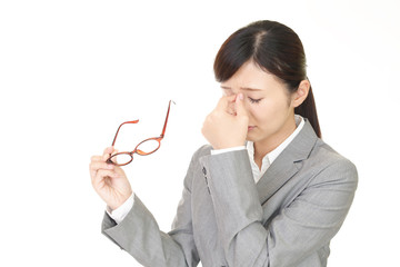 疲れた表情のビジネスウーマン