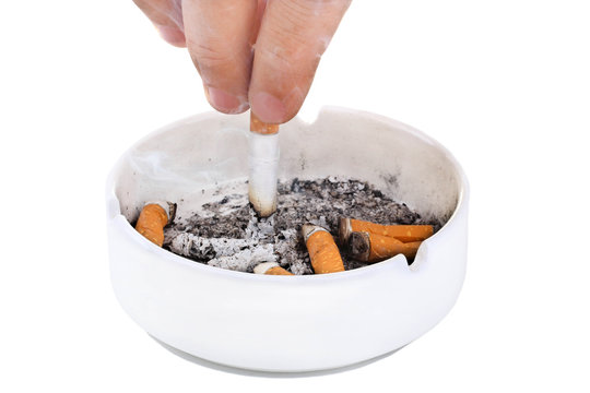 man strusevich the ashes from the cigarette with an orange filter in the ashtray on white isolated background