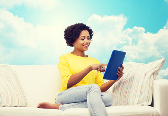 happy african american woman with tablet pc