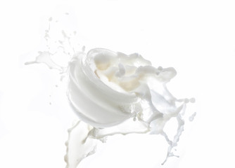 Moisturizing cream, moisturizing milk in the big milk splash isolated on the white background with...
