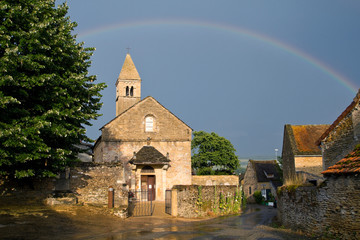 Church with a rainbow of Taize ,Burgundy.