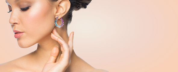 close up of beautiful woman face with earring