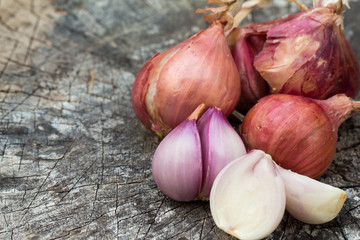 Red onion on wooden background 