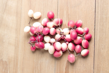 carunda fruit on wooden background