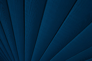 Deep blue wooden background. Diagonal boards. Wood texture.