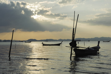 long tail boat and sunset