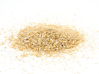 Fototapeta na wymiar Pile of oat bran isolated on white