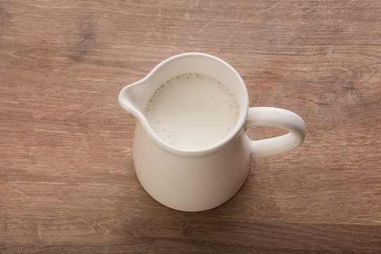 White pitcher with milk