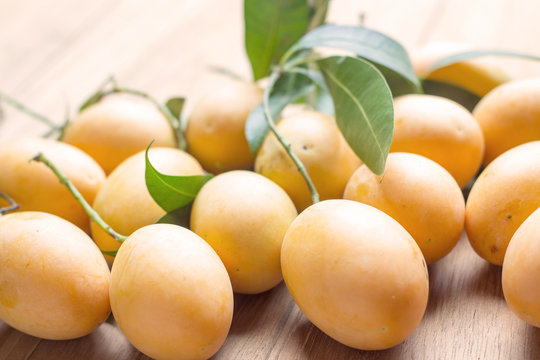 thai plango with leaf on wood background