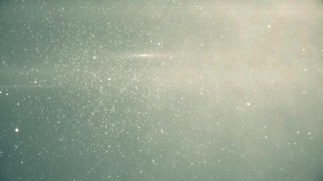 Slow motion of the blurred and glowing particles.