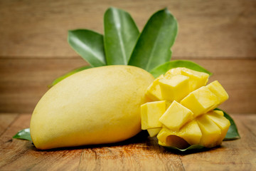 mango on a dark wood background. tinting.