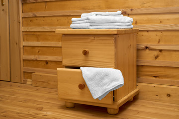Fototapeta na wymiar chest of drawers with a clean towel