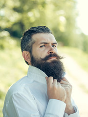 Bearded man on blue sky