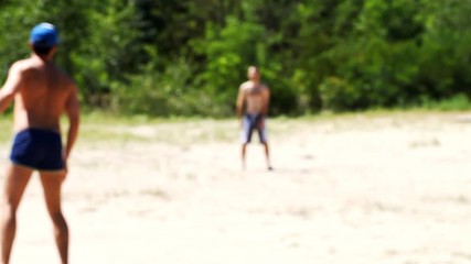 two men playing Frisbee on the nature   /  two men playing Frisbee on the nature, blurred background - Powered by Adobe