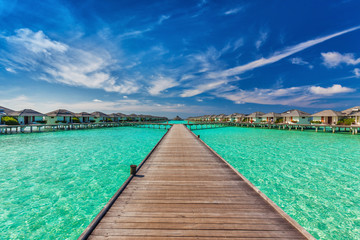 Beautiful water villas on the sea with the bridge, Maldives