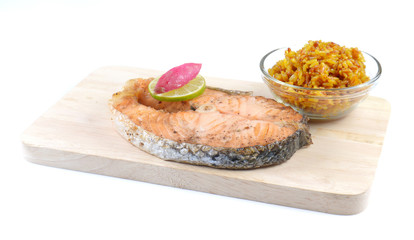 Salmon steaks,Turmeric rice in glass bowl,wooden Cutting Board o