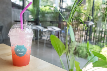 strawberry soda in glass with smiling face