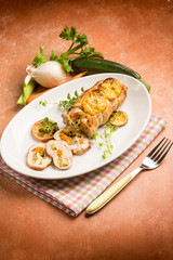 turkey roast stuffed with mixed vegetables an sliced lemon