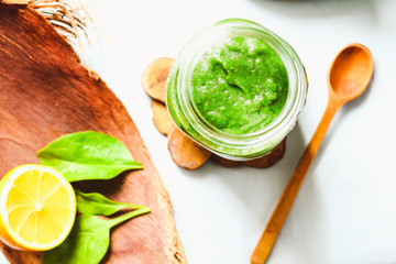 green detox smoothie with spinach, kiwi and citrus, top view