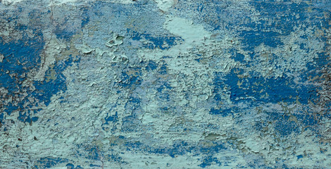 Old weathered paint on a concrete wall. Blue abstract background.