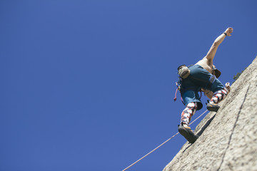 Rock climber climbing mountain