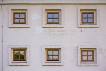 vintage brick wall background with six old windows