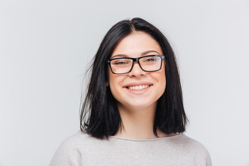 Portrait of a brunette girl in black glasses