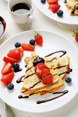 pancakes with berries and sauce