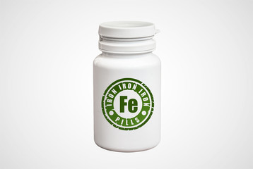 Bottle of pills with iron Fe