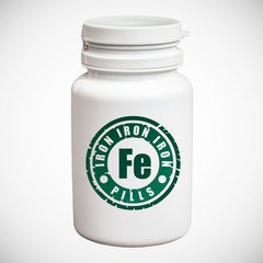 Bottle of pills with iron Fe