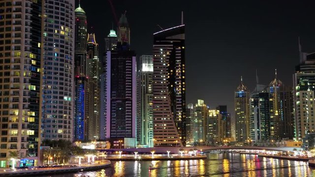 4K Dubai Marina night time lapse, United Arab Emirates. Dubai Marina - the largest man-made marina in the world. Dubai Marina is a canal city, carved along a 3 km stretch of Persian Gulf shoreline