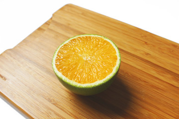 Sliced orange in the board white background