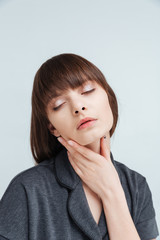 Young relaxed woman with closed eyes