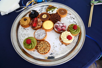 petit four/ petit fours lying on a tray ready to be served