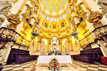 Wide view inside cathedral architecture ceiling decorated with marble, in Malaga - Spain