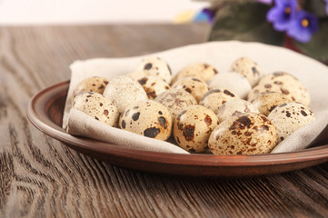 Quail eggs in a clay plate