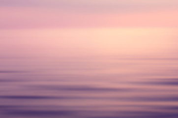 Naklejka na ściany i meble Motion blur tropical sunset beach and smooth wave. Travel concept.