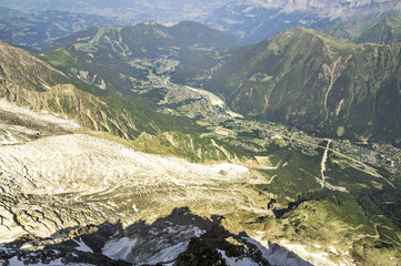Foggy summer landscape with Chamonix aerial view and mountains in Mont Blanc, top massif in France. Most popular summer and winter, sports and touristic destination in French Alps.