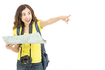 Happy tourist woman pointing to a direction