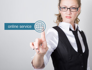 technology, internet and networking concept. beautiful woman in a black business shirt. woman presses online service button on virtual screens