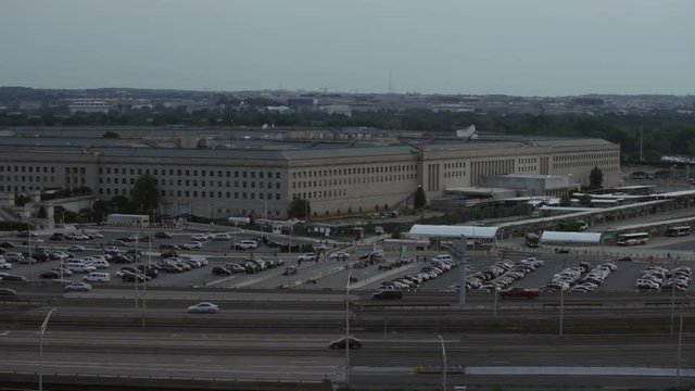 The Pentagon building and busy highway during overcast day in Washington DC, USA.