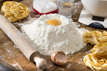 fresh homemade fettuccine on the kitchen table. Italian