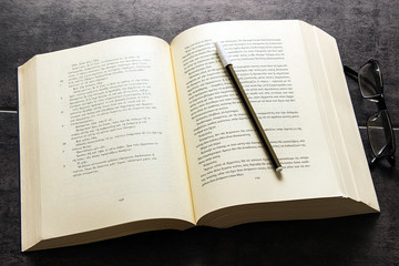 Fototapeta premium Great book, pen and glasses