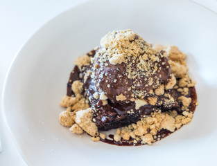 Brownie topped with chocolate ice-cream